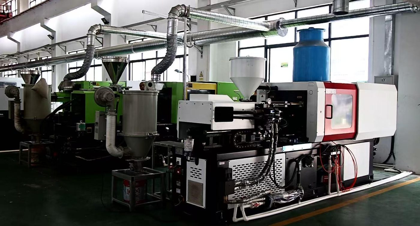 Injection molding line producing mirror housings and backing plates
